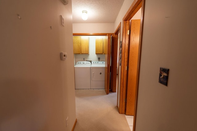 2842 19th Ave NW, Rochester, MN 55901 - hallway with washer and dryer, light colored carpet, and a textured ceiling