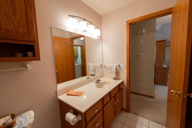 2842 19th Ave NW, Rochester, MN 55901 - bathroom with tile patterned floors, vanity, and baseboards