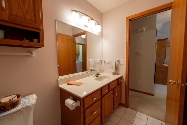 2842 19th Ave NW, Rochester, MN 55901 - bathroom with vanity, tile patterned floors, and baseboards