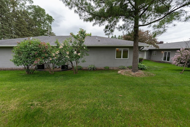 2842 19th Ave NW, Rochester, MN 55901 - back of property with a lawn and roof with shingles