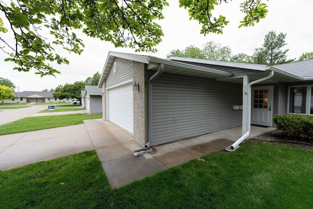 2842 19th Ave NW, Rochester, MN 55901 - view of side of home with a garage, a lawn, and brick siding