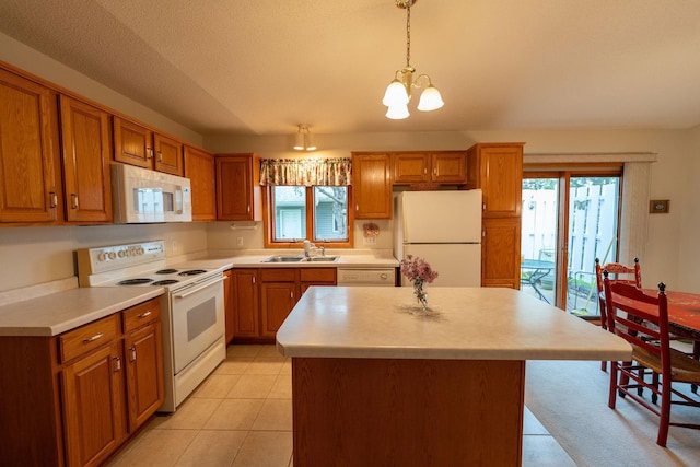 2842 19th Ave NW, Rochester, MN 55901 - kitchen featuring white appliances, a sink, brown cabinetry, light countertops, and a textured ceiling