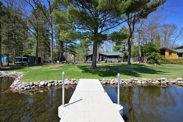 10151 Sandy Beach Rd, Round Lake Twp, WI 54843 - dock area with a lawn and a water view