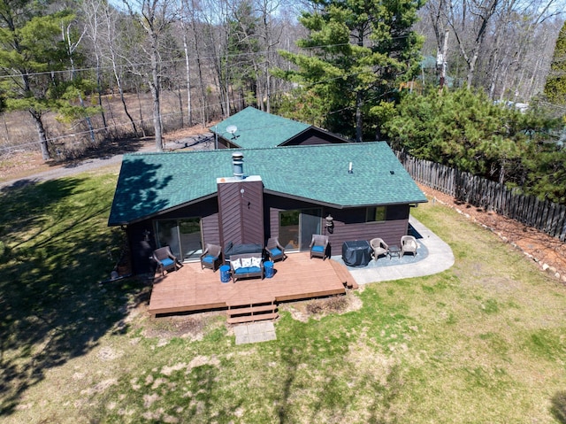 10151 Sandy Beach Rd, Round Lake Twp, WI 54843 - rear view of house featuring a wooden deck, roof with shingles, and an outdoor hangout area