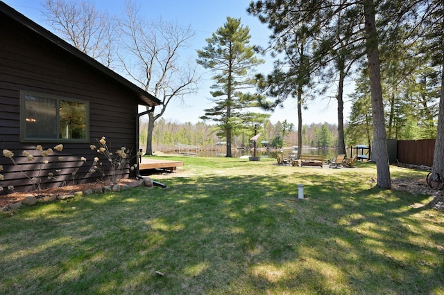 10151 Sandy Beach Rd, Round Lake Twp, WI 54843 - view of yard featuring a fire pit and a wooden deck