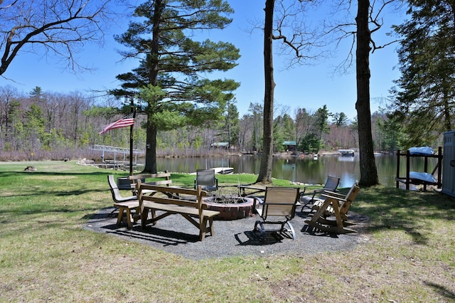 10151 Sandy Beach Rd, Round Lake Twp, WI 54843 - view of grassy yard featuring a fire pit and a water view