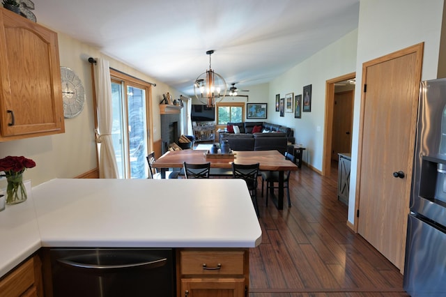 10151 Sandy Beach Rd, Round Lake Twp, WI 54843 - kitchen featuring stainless steel appliances, dark wood-type flooring, a fireplace, open floor plan, and light countertops