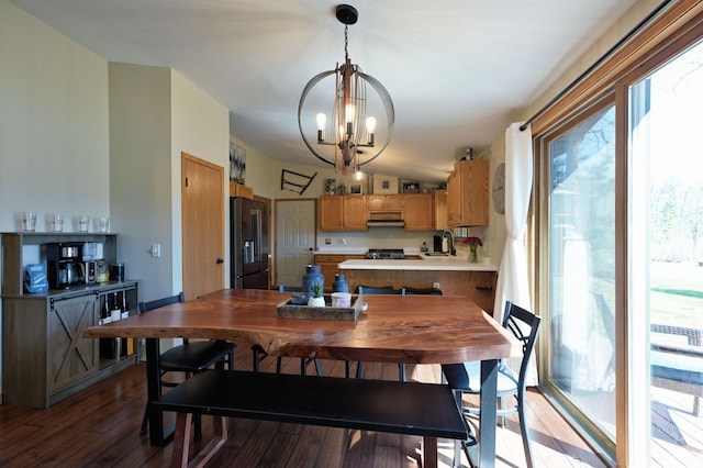 10151 Sandy Beach Rd, Round Lake Twp, WI 54843 - dining space with a chandelier, light wood-style floors, and lofted ceiling