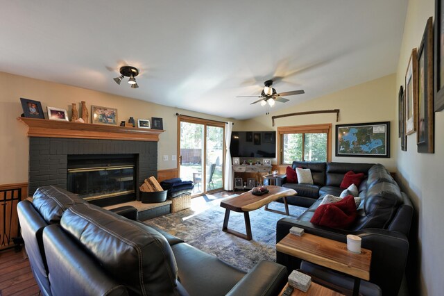 10151 Sandy Beach Rd, Round Lake Twp, WI 54843 - living room with dark wood-style flooring, ceiling fan, a brick fireplace, and vaulted ceiling