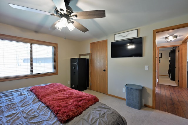 10151 Sandy Beach Rd, Round Lake Twp, WI 54843 - bedroom with ceiling fan, light carpet, and baseboards