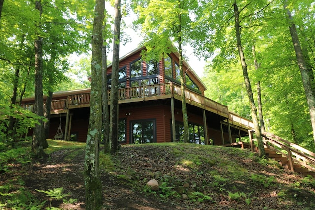 2207 Barron Polk St, Comstock, WI 54826 - rear view of house with log veneer siding and a deck