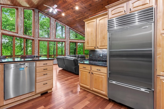 2207 Barron Polk St, Comstock, WI 54826 - kitchen featuring stainless steel appliances, wooden ceiling, light brown cabinetry, wood finished floors, and high vaulted ceiling