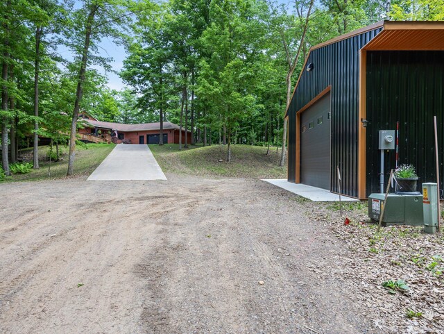 2207 Barron Polk St, Comstock, WI 54826 - exterior space with driveway and a detached garage