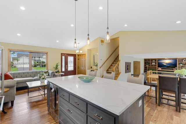 5630 Oak View Ct, Savage, MN 55378 - kitchen with open floor plan, beverage cooler, lofted ceiling, light wood-type flooring, and gray cabinets