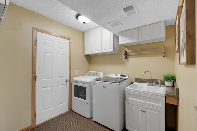 5630 Oak View Ct, Savage, MN 55378 - washroom featuring washer and dryer, cabinet space, and a textured ceiling