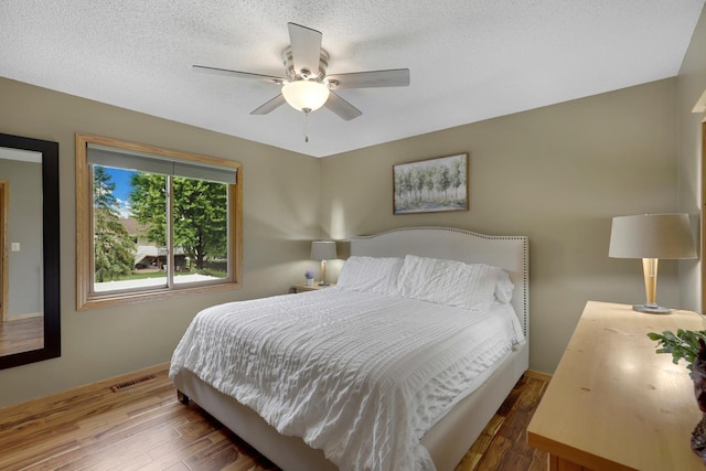 5630 Oak View Ct, Savage, MN 55378 - bedroom with wood finished floors and ceiling fan