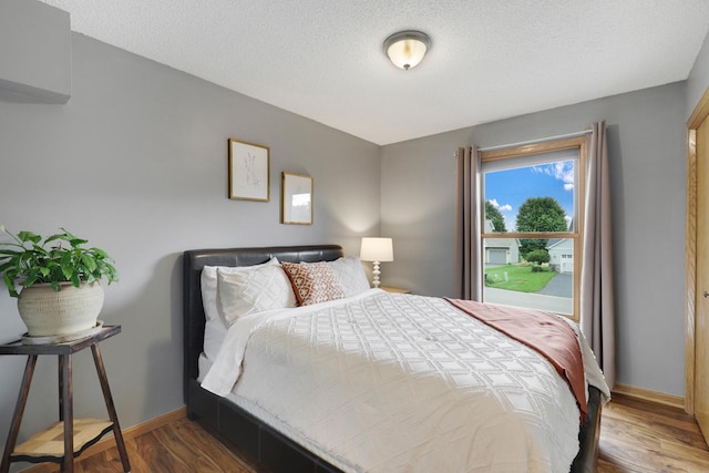 5630 Oak View Ct, Savage, MN 55378 - bedroom featuring wood finished floors and a textured ceiling