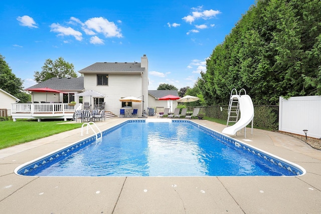5630 Oak View Ct, Savage, MN 55378 - view of swimming pool featuring a water slide, a patio area, and a wooden deck