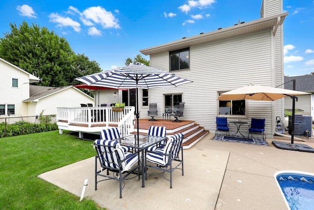 5630 Oak View Ct, Savage, MN 55378 - rear view of house with outdoor dining space, a wooden deck, a lawn, and a patio