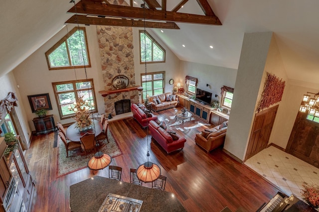 31839 Cree Bay Cir, Pelican Twp, MN 56472 - living area featuring a fireplace, high vaulted ceiling, wood finished floors, beam ceiling, and baseboards