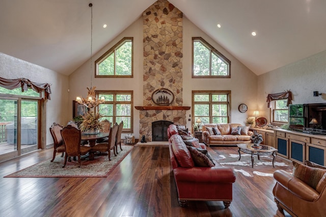 31839 Cree Bay Cir, Pelican Twp, MN 56472 - living area with high vaulted ceiling, a chandelier, a stone fireplace, and plenty of natural light