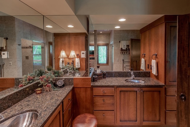 31839 Cree Bay Cir, Pelican Twp, MN 56472 - bathroom featuring two vanities, healthy amount of natural light, tiled shower, and recessed lighting