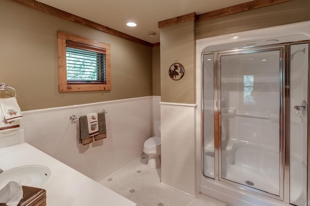 31839 Cree Bay Cir, Pelican Twp, MN 56472 - full bath with a stall shower, tile walls, a wainscoted wall, toilet, and vanity