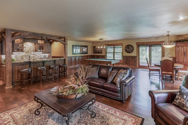 31839 Cree Bay Cir, Pelican Twp, MN 56472 - living area with pool table, wainscoting, wet bar, and dark wood-type flooring