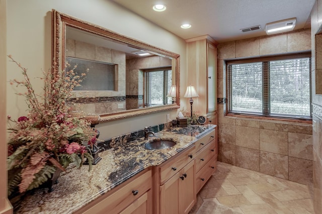 31839 Cree Bay Cir, Pelican Twp, MN 56472 - full bathroom featuring vanity, recessed lighting, and stone finish flooring
