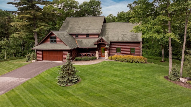 31839 Cree Bay Cir, Pelican Twp, MN 56472 - log home with a front yard, a shingled roof, asphalt driveway, and a garage