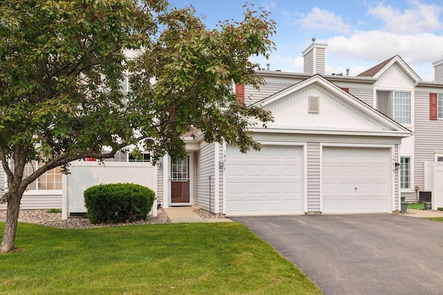 14617 Evergreen Trl Unit 75, Apple Valley, MN 55124 - view of front of property with driveway, an attached garage, and a chimney