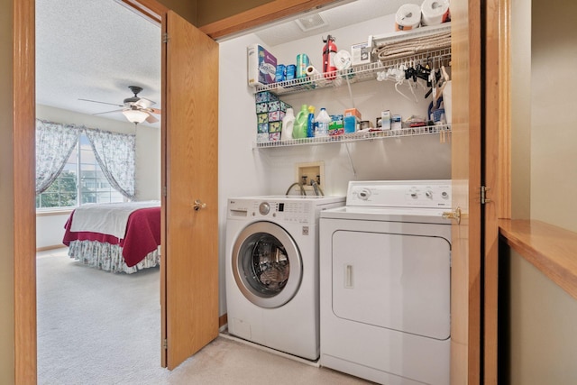 14617 Evergreen Trl Unit 75, Apple Valley, MN 55124 - laundry room featuring washer and clothes dryer, light colored carpet, ceiling fan, and a textured ceiling