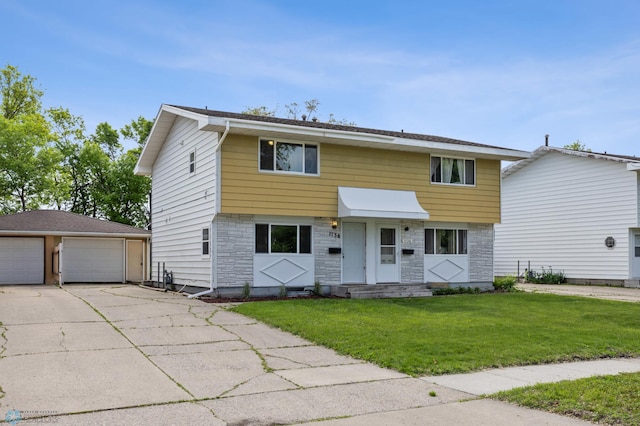 1138 20th St N, Moorhead, MN 56560 - colonial home with an outdoor structure, a garage, stone siding, and a front yard