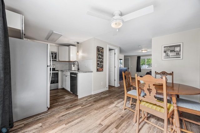1138 20th St N, Moorhead, MN 56560 - dining room featuring light wood-style floors and a ceiling fan