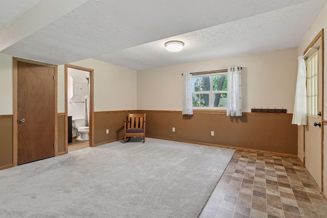 3228 Spruce Trl SW, Prior Lake, MN 55372 - unfurnished bedroom with a textured ceiling and connected bathroom