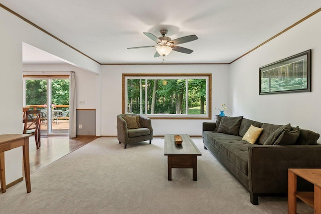 3228 Spruce Trl SW, Prior Lake, MN 55372 - living room with light carpet, a ceiling fan, and crown molding