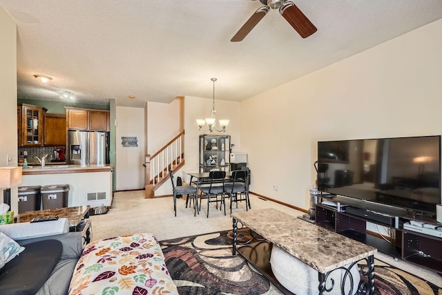 7754 Lachman Ave NE, Otsego, MN 55301 - living room with light carpet, a chandelier, stairs, a ceiling fan, and baseboards