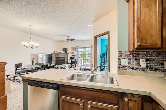 7754 Lachman Ave NE, Otsego, MN 55301 - kitchen with stainless steel dishwasher, a sink, decorative backsplash, a textured ceiling, and ceiling fan