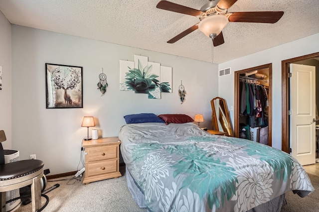 7754 Lachman Ave NE, Otsego, MN 55301 - bedroom featuring light colored carpet, a closet, baseboards, ceiling fan, and a textured ceiling