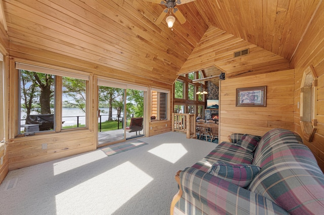 6031 232nd St W, Faribault, MN 55021 - carpeted living area with wooden walls, wooden ceiling, a water view, and high vaulted ceiling