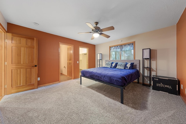 6031 232nd St W, Faribault, MN 55021 - bedroom with carpet, ceiling fan, ensuite bathroom, and baseboards