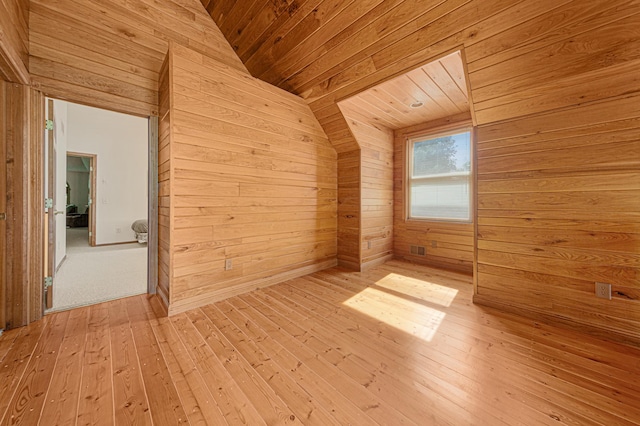 6031 232nd St W, Faribault, MN 55021 - spare room with wood walls, vaulted ceiling, wooden ceiling, and hardwood / wood-style floors