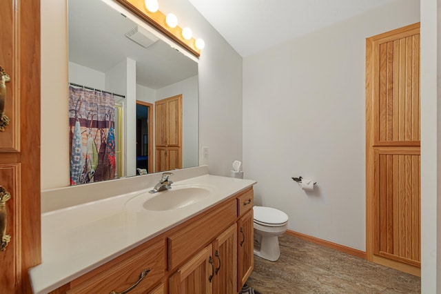 6031 232nd St W, Faribault, MN 55021 - full bath with vanity, toilet, wood finished floors, and baseboards