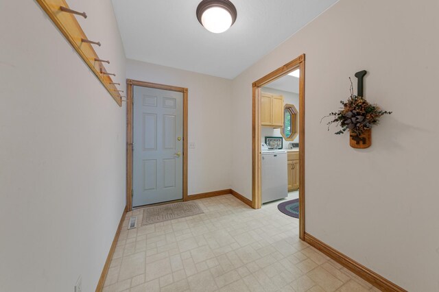 6031 232nd St W, Faribault, MN 55021 - corridor featuring washer / dryer, baseboards, and light flooring