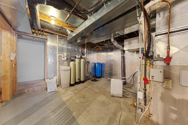 6031 232nd St W, Faribault, MN 55021 - unfinished basement featuring a water pressure tank and a water softener