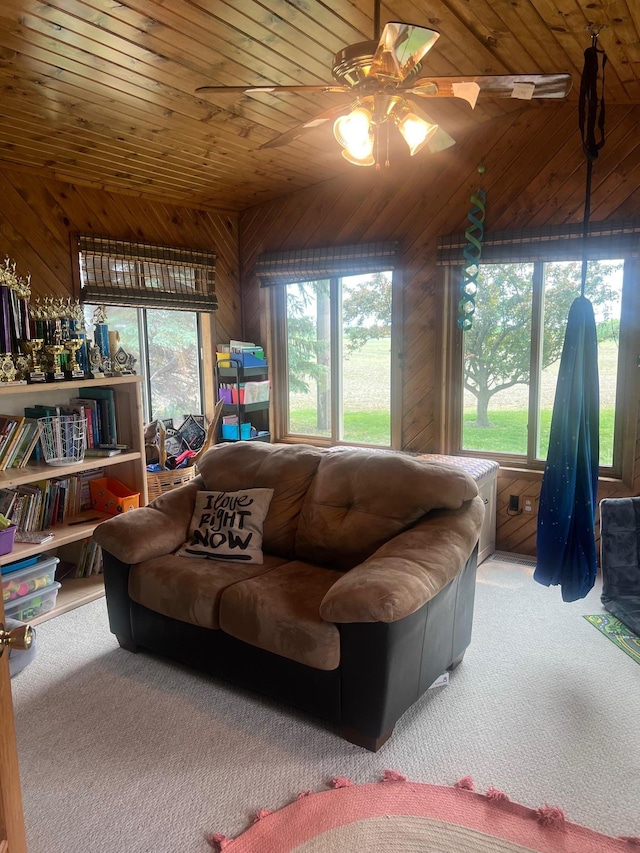 20906 624th Ave, Litchfield, MN 55355 - carpeted living area featuring wooden ceiling, a ceiling fan, wood walls, and lofted ceiling