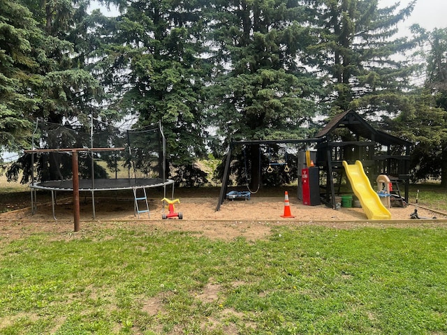 20906 624th Ave, Litchfield, MN 55355 - communal playground featuring a trampoline, a yard, and view of wooded area
