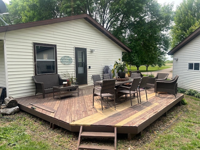 20906 624th Ave, Litchfield, MN 55355 - wooden deck with outdoor dining space and an outdoor living space