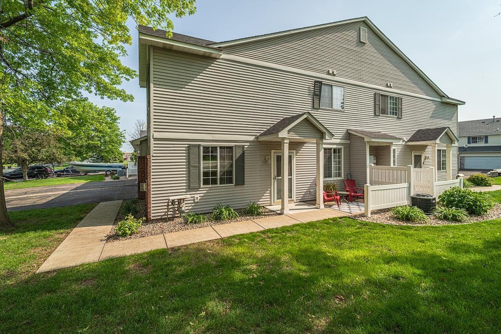 1667 Brittany Dr, Shakopee, MN 55379 - rear view of property featuring a lawn