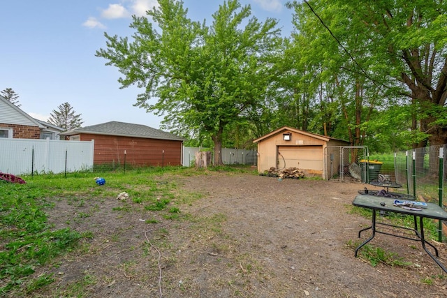 86 Somerville St S, Morgan, MN 56266 - view of yard featuring a detached garage and an outbuilding